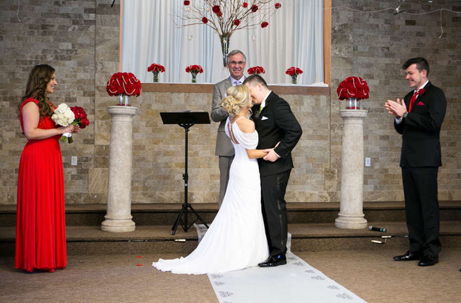 Golden Gates Wedding, Philadelphia Wedding, Heidi Roland Photography, church ceremony, red flower, flower petals, first kiss 