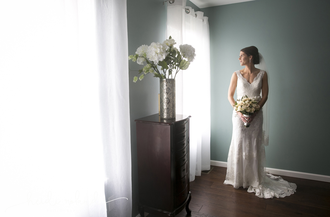 Heidi Roland Photography, bride looking out the window