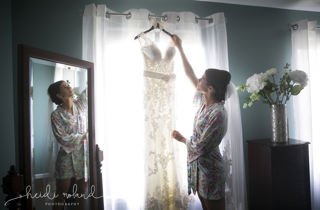 Heidi Roland Photography, bride and wedding dress in window, bride robe