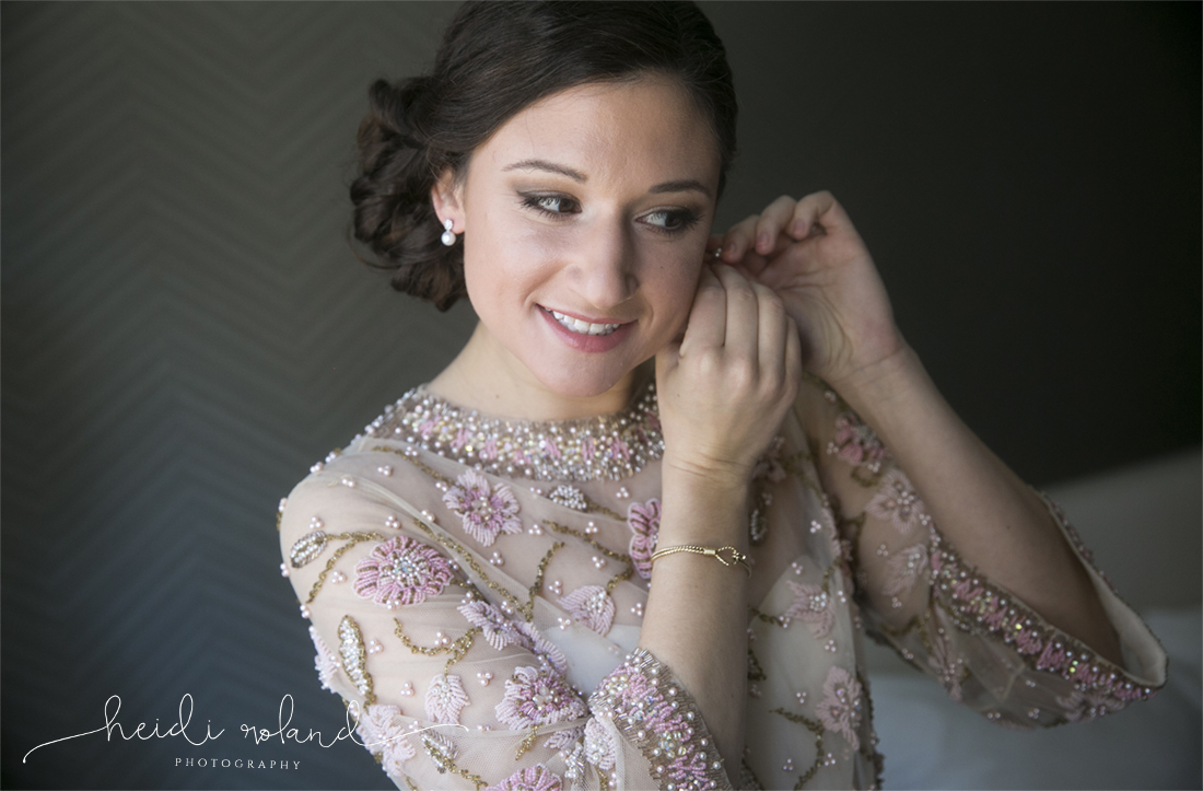 Heidi Roland Photography, bride putting on earrings