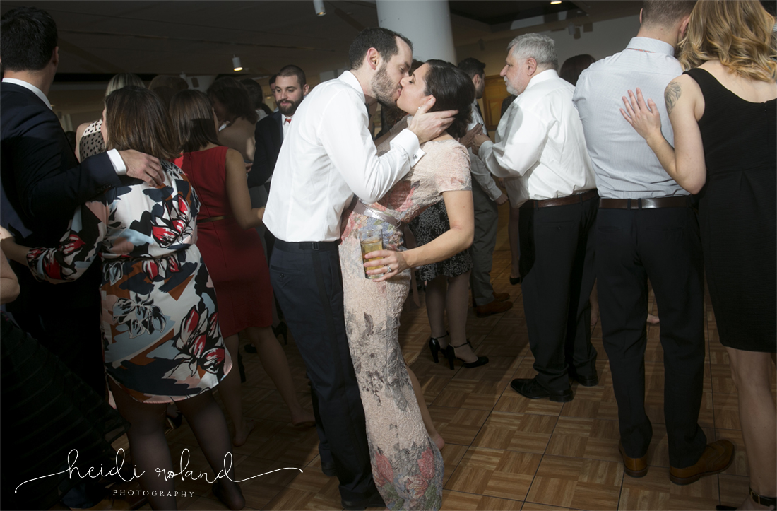 Heidi roland photography, bride and groom kiss on dancefloor