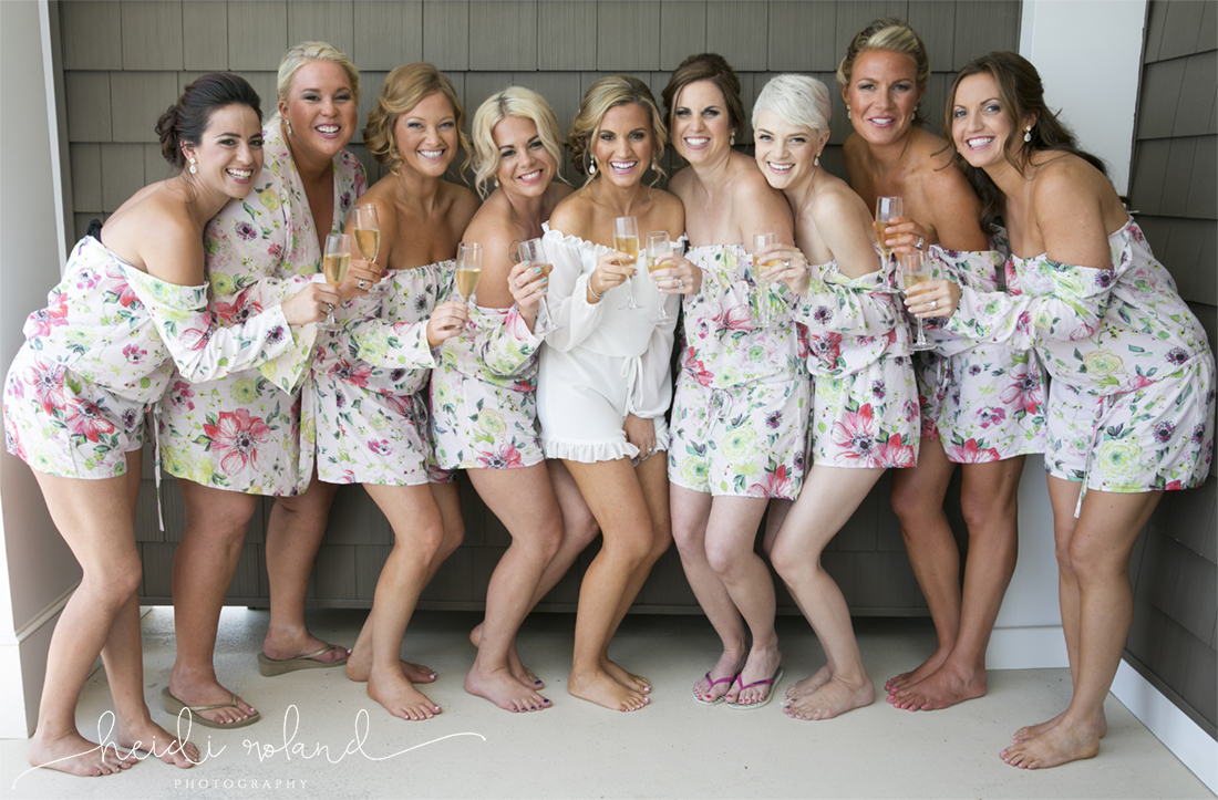 Icona Golden Inn wedding, bridesmaids in romper with champagne