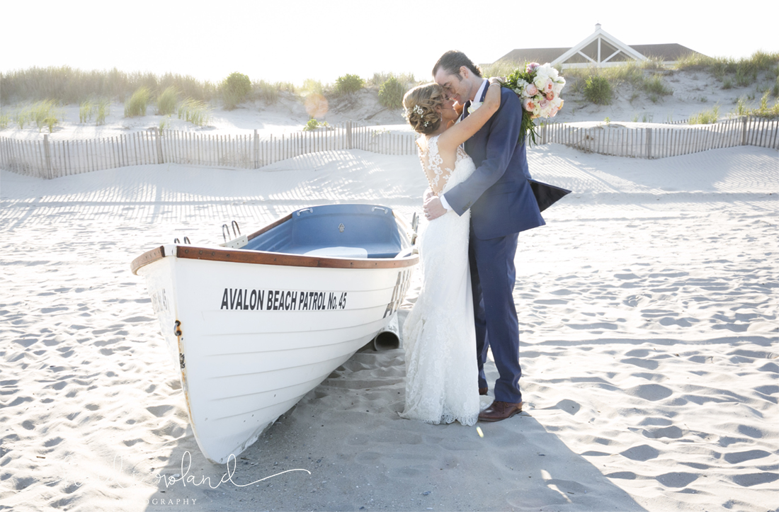 Icona Golden Inn wedding, bride and groom boat on beach