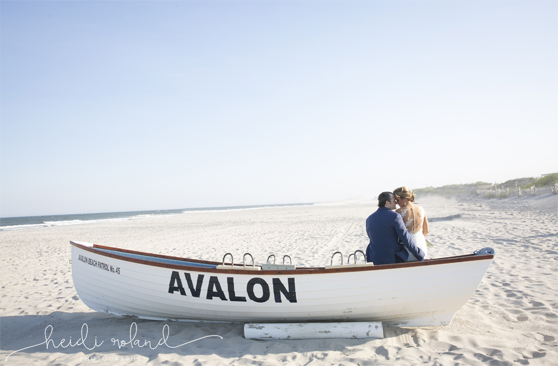 Icona Golden Inn wedding, bride and groom boat on beach portriats