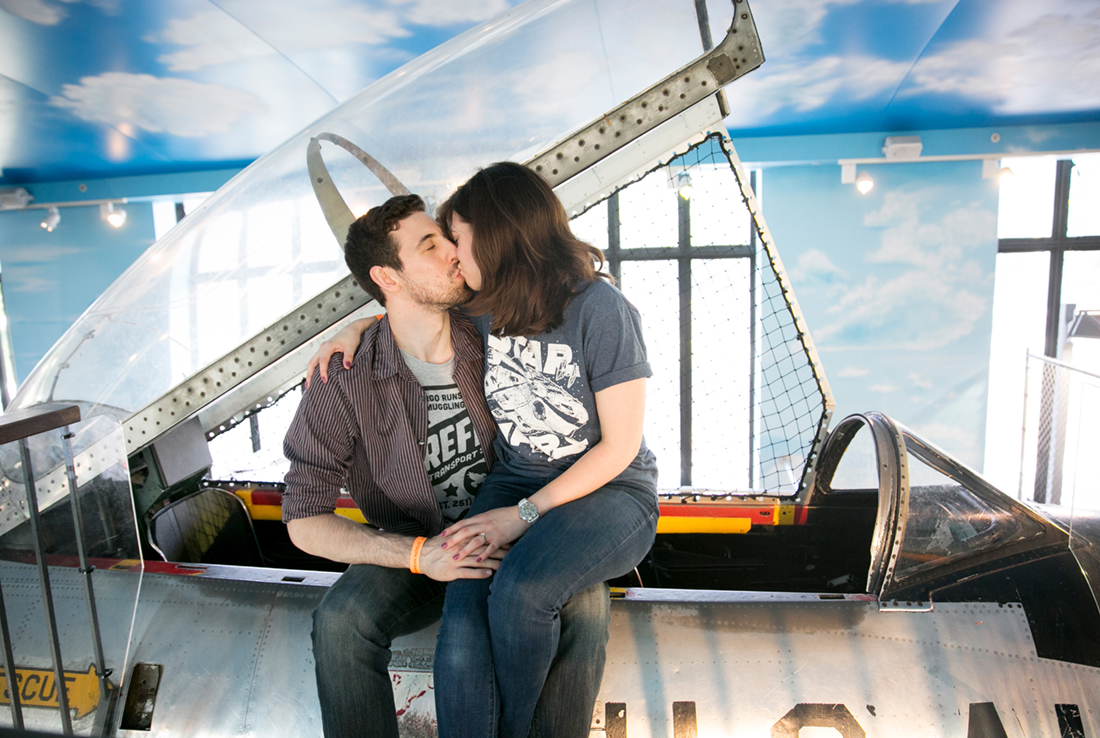franklin institute engagement, couple kissing in airplane 