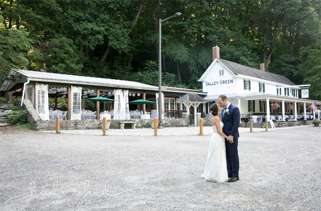 Valley Green Inn Wedding, bride and groom pose in front of the venue