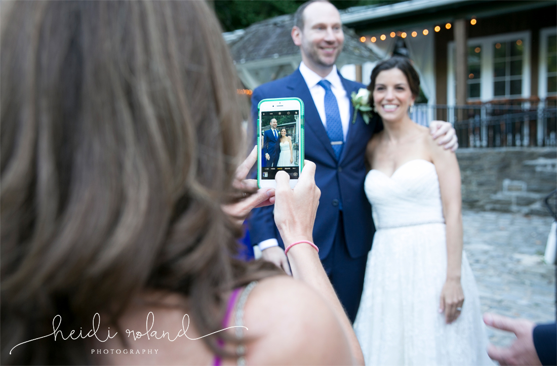 Valley Green Inn Wedding, guest taking photo of bride and groom with cell phone