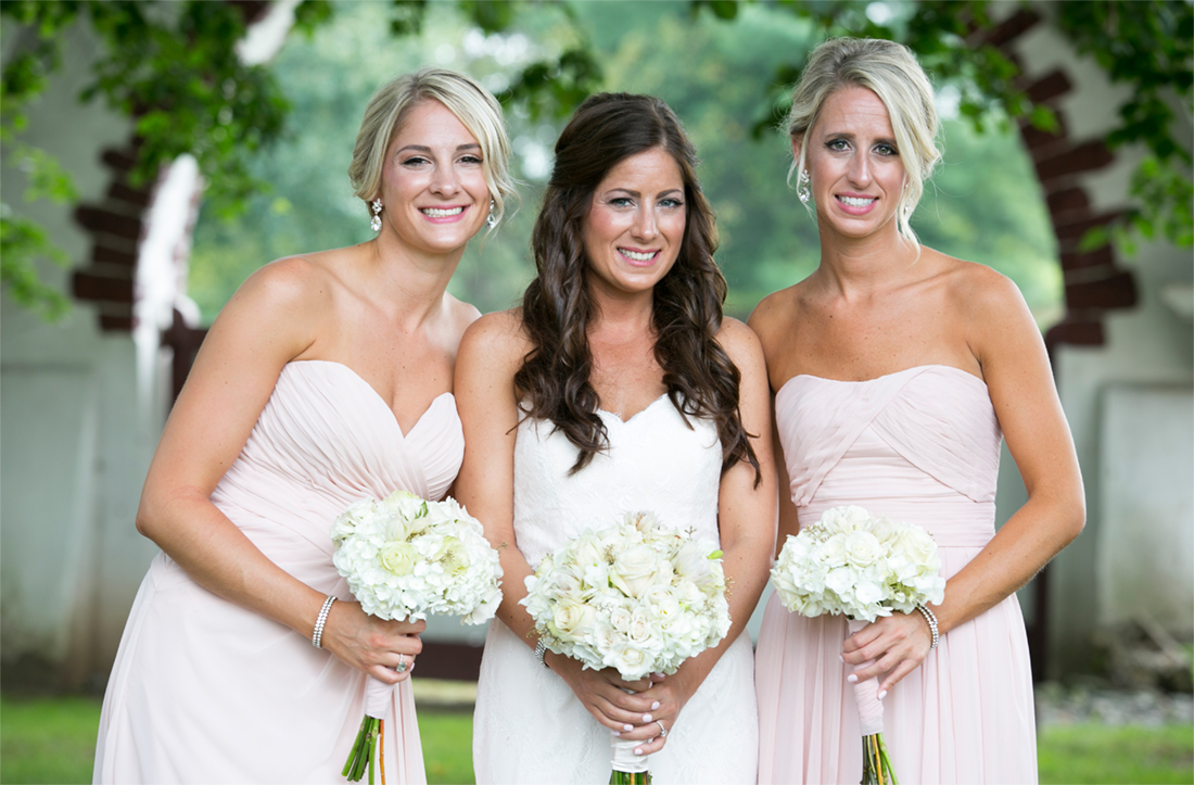bride with bridesmaids in blush dresses