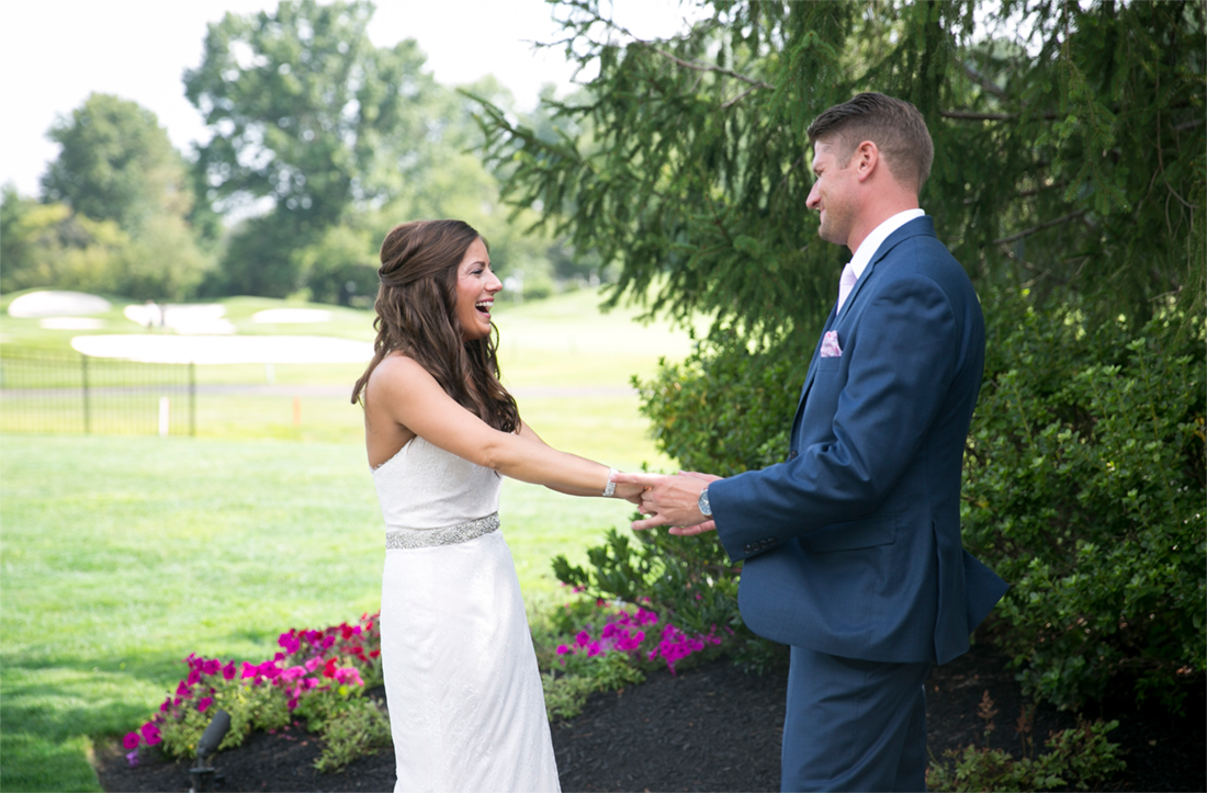bride and groom first look at Blue Bell Country Club 