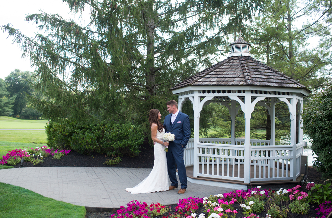 Bride and groom portrait by gazebo at Blue Bell Country Club 