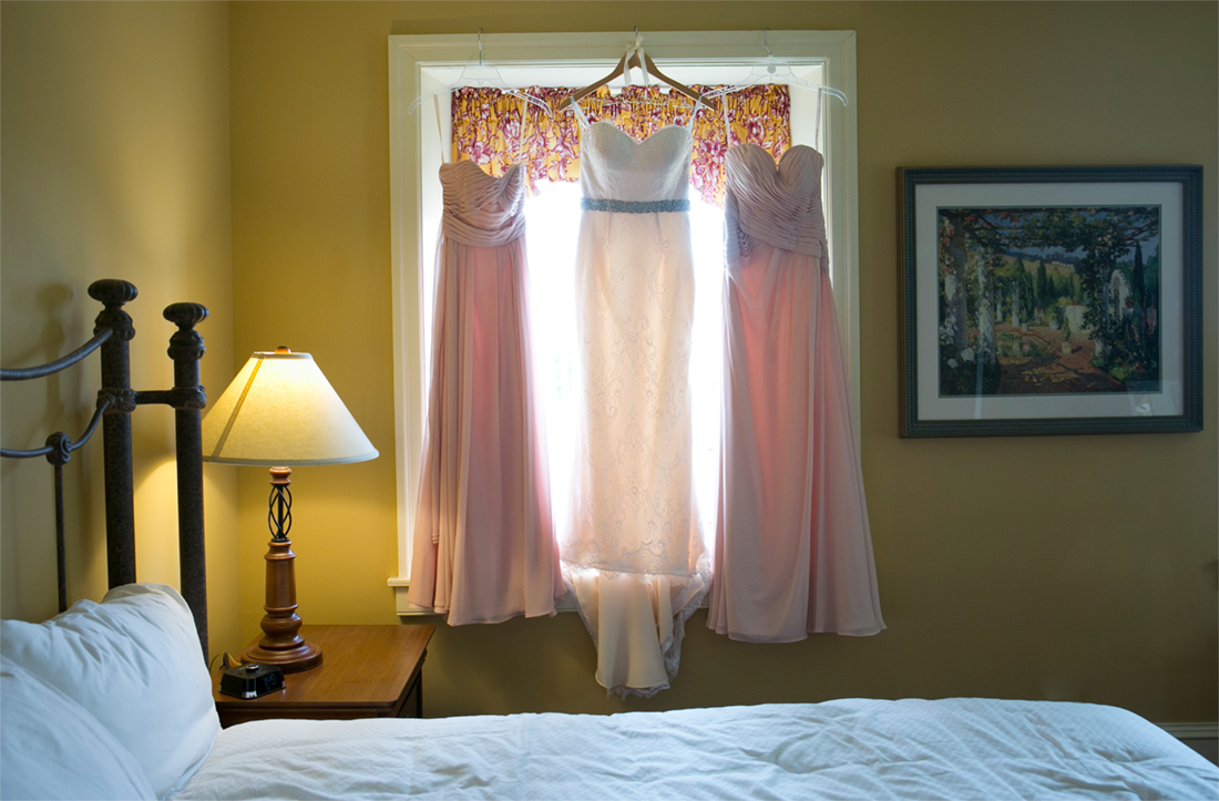 Normandy Farms Wedding dress with bridesmaids dresses hanging in window