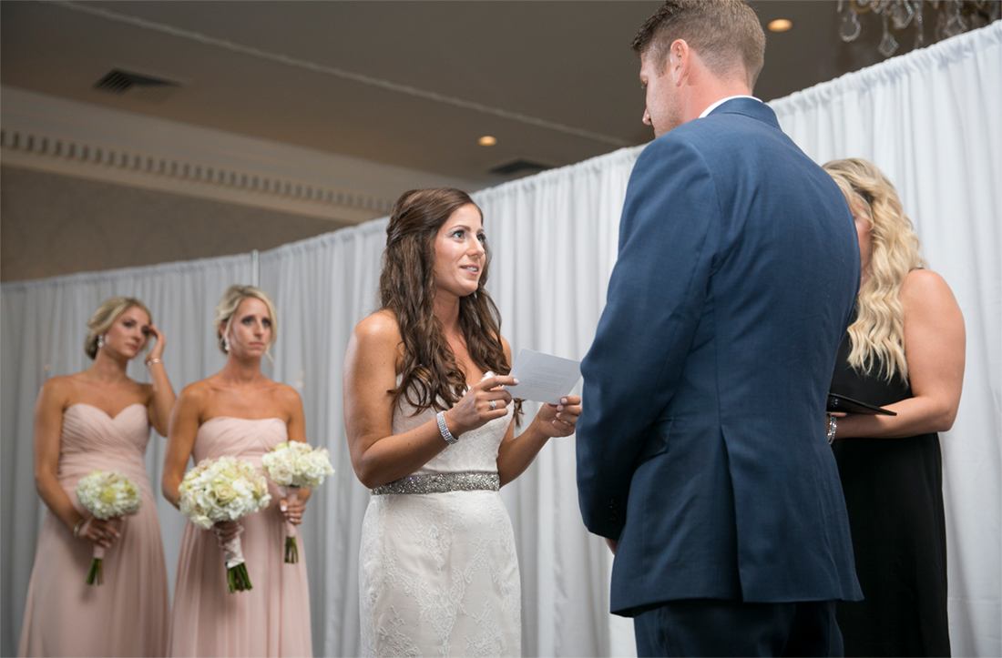 bride reads her wedding vows at Blue Bell Country Club wedding