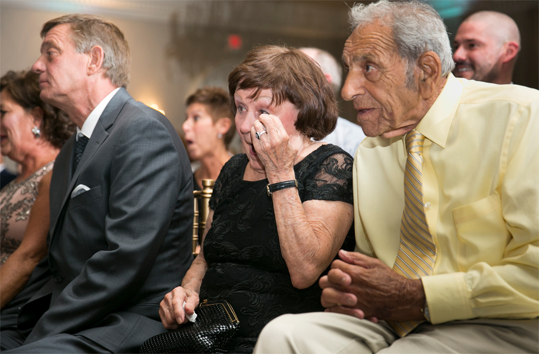 grandma wipes away a tear at ceremony Blue Bell Country Club wedding