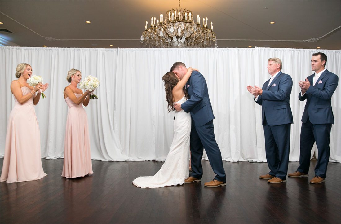 bride and groom's first kiss Blue Bell Country Club wedding