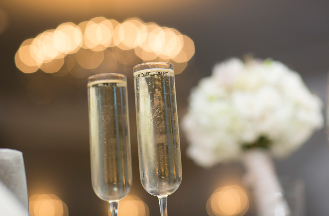 bride and groom champagne glasses at reception