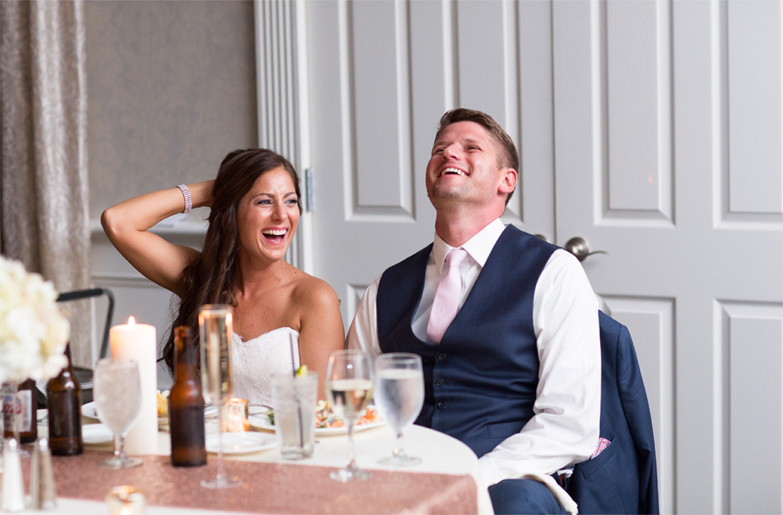 bride and groom laugh at toasts Blue Bell Country Club wedding