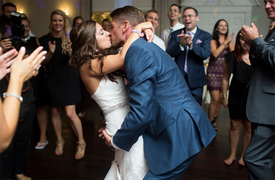 bride and groom kiss on dancefloor Blue Bell Country Club wedding