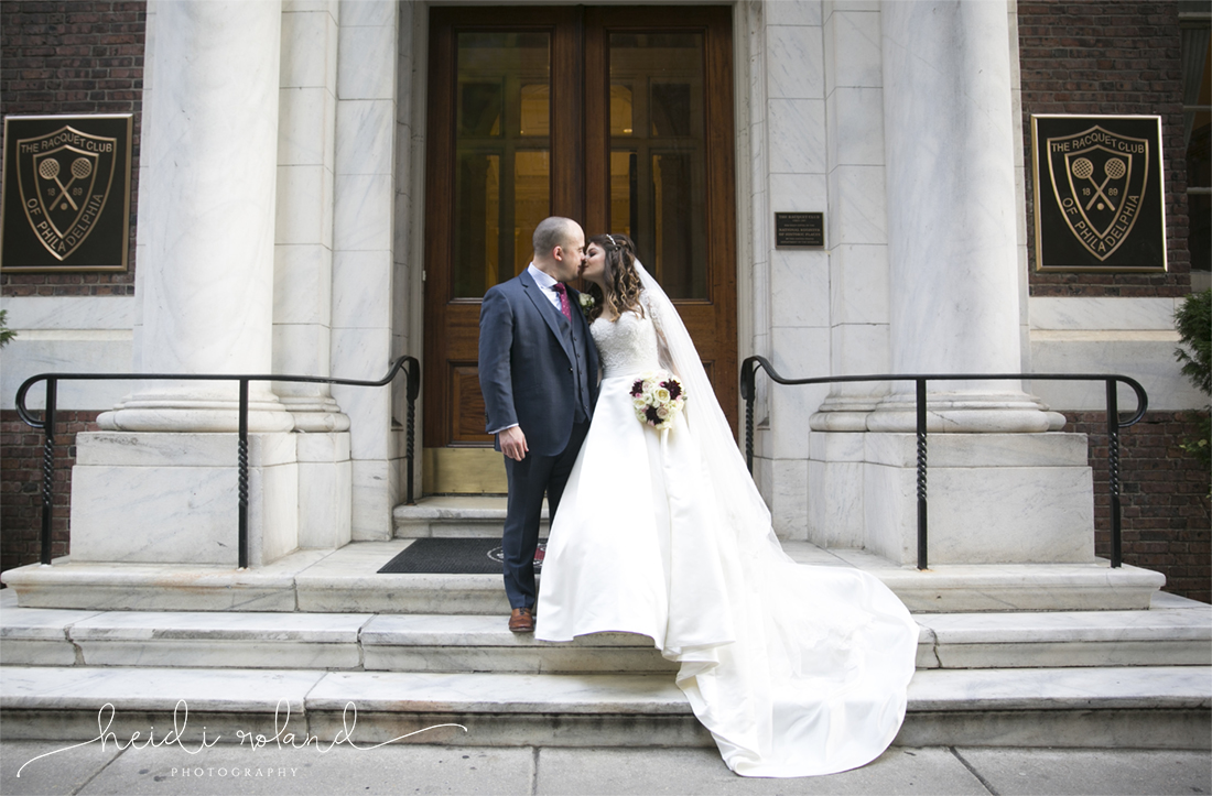 Racquet Club Of Philadelphia Wedding bride and groom kiss outside venue