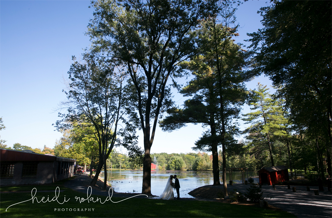 rustic barn wedding, Memorytown USA, bride and groom silhouette on lake 
