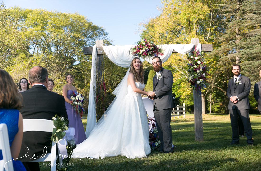 rustic barn wedding, Memorytown USA, bride and groom at alter