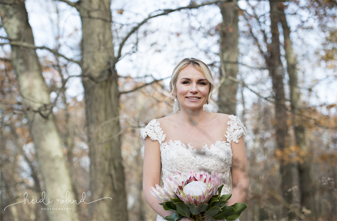 Heidi Roland Photography, Rustic Fall Wedding, bride in the woods big bridal flowers
