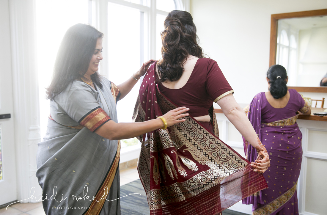 Interfaith wedding Pomme, bride getting wrapped in sari