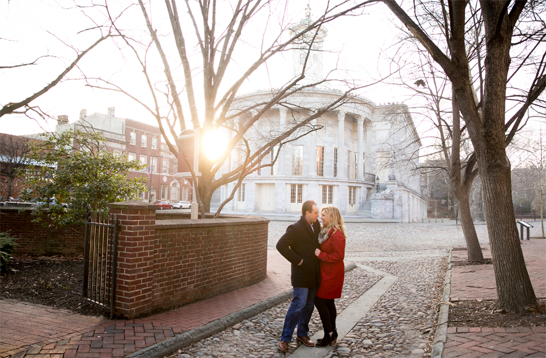 casual winter engagement session Old City Philadelphia Merchant Exchange, sunflare