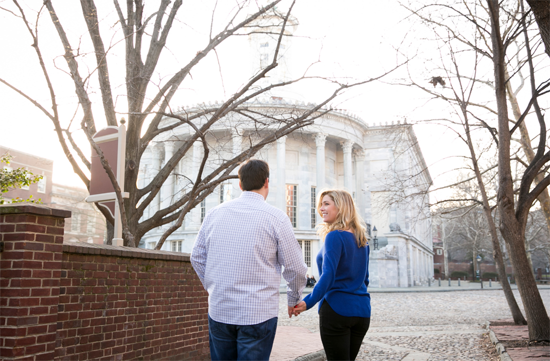 casual winter engagement session Old City Philadelphia Merchant Exchange, holding hands