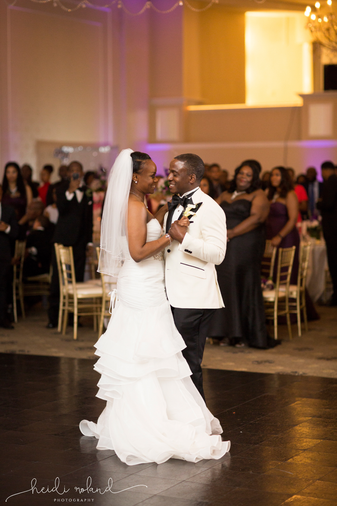  bride and groom first dance in regal ballroom
