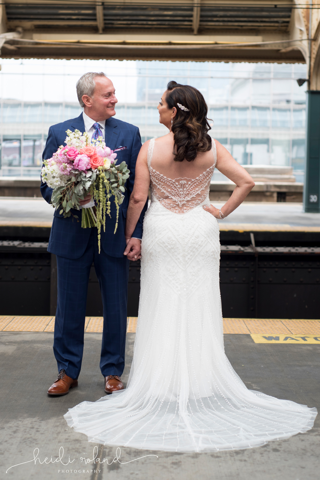 30th street station train platform couples wedding photos, big bold bouquet