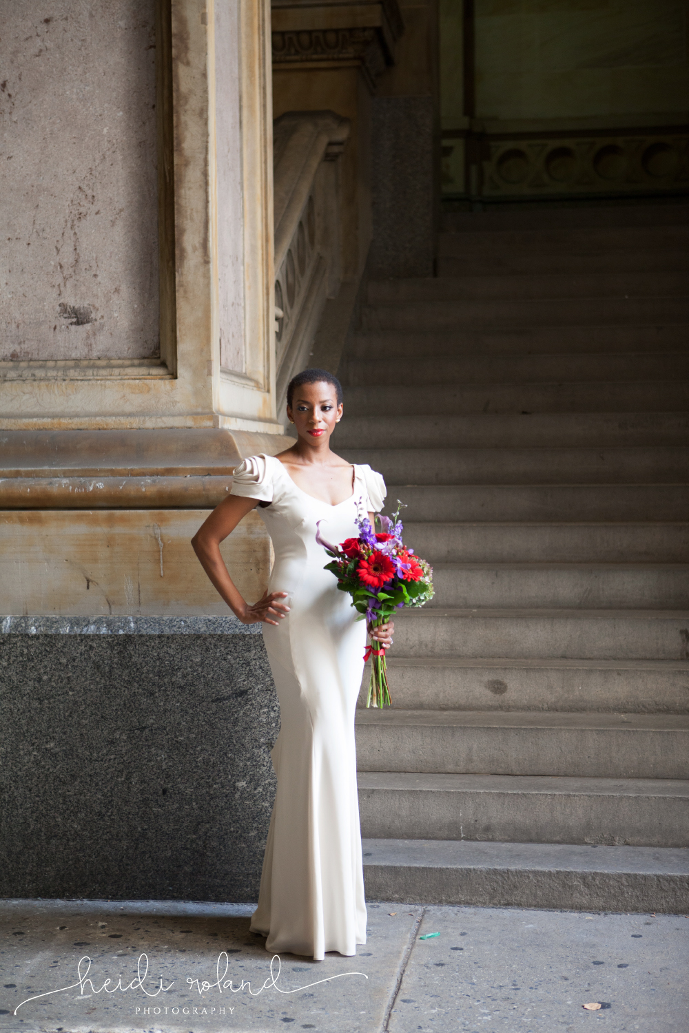 bride in long ivory gown city hall