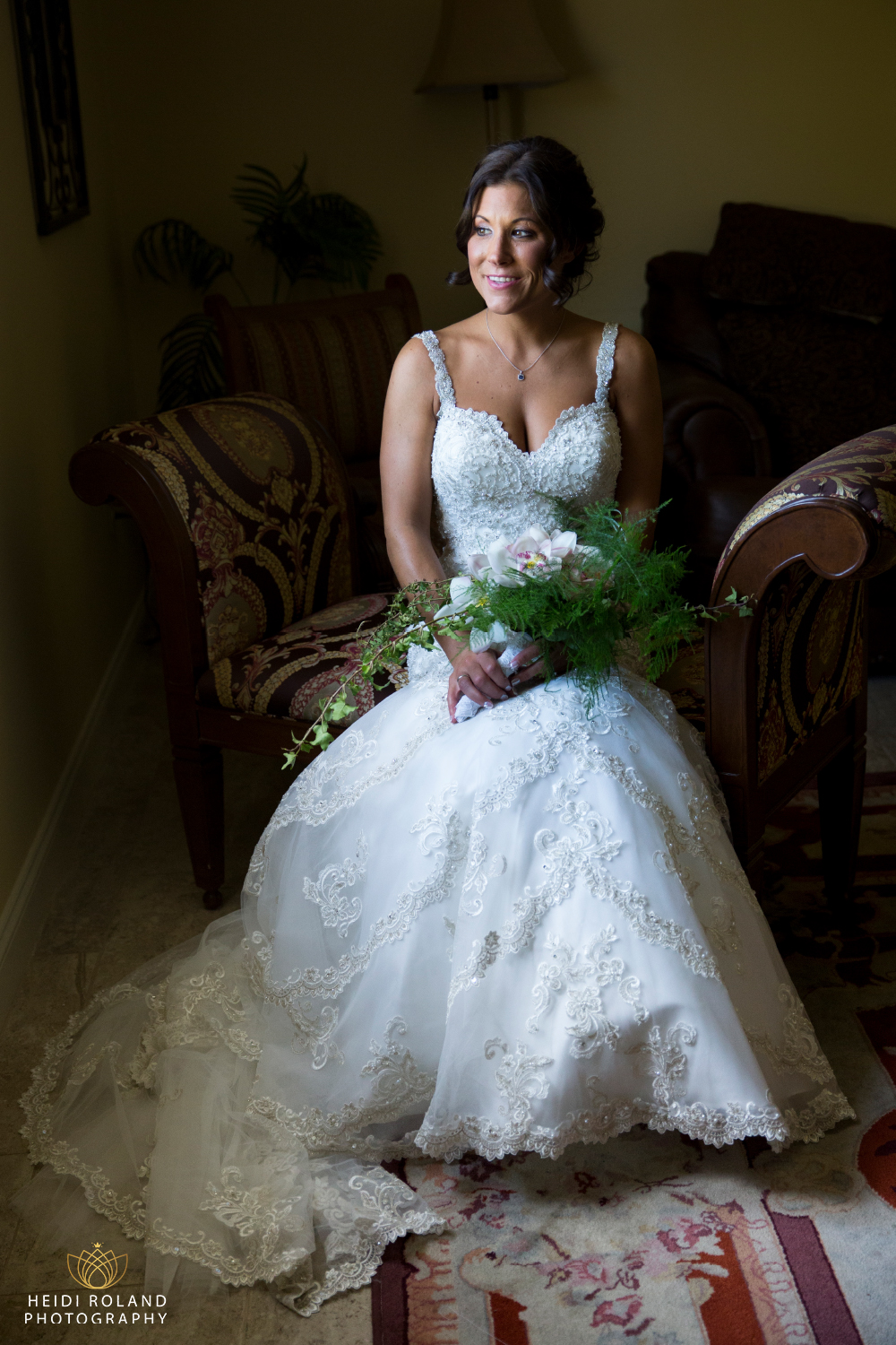 Bride sitting by window at Spring Mill Manor Wedding