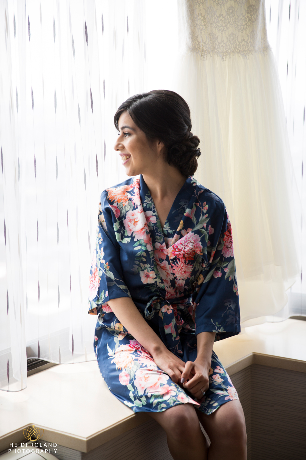 Bride in floral robe at The DoubleTree Philadelphia