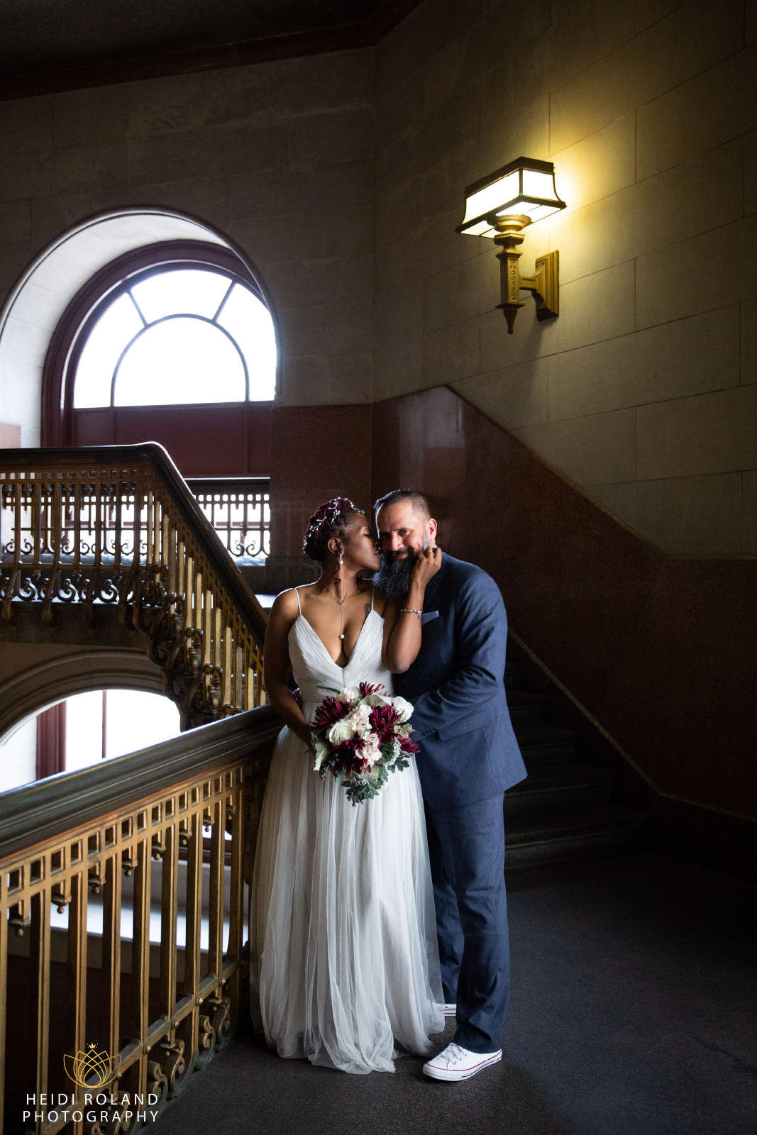 bride and groom in City Hall Staircase Philadelphia