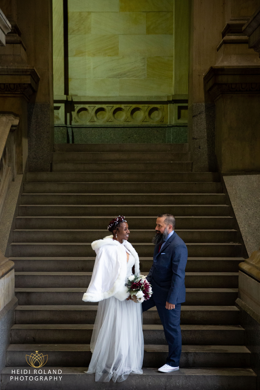 bride and groom on stairs at Philadelphia City Hall