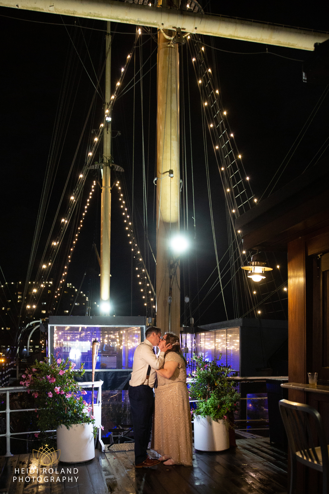 night photo of bride and groom on Moshulu ship Philadelphia