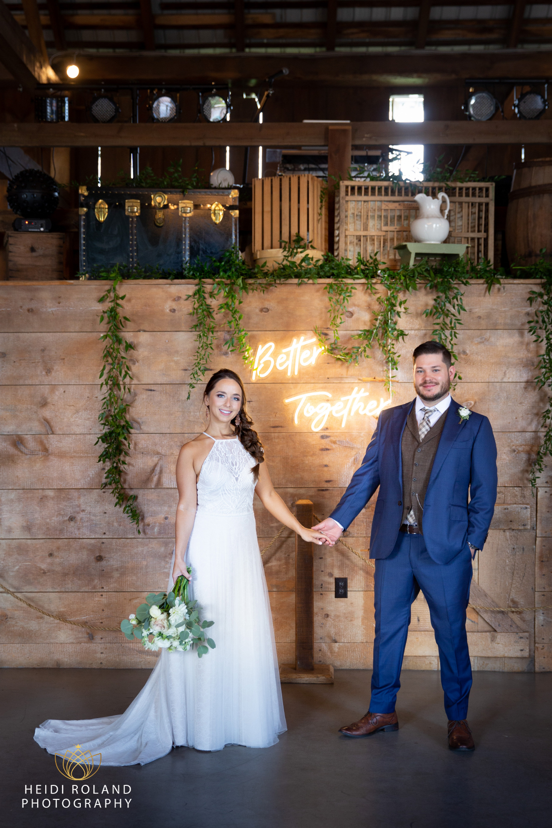 bride and groom in front of "better together" neon sign at Stoltzfus homestead wedding