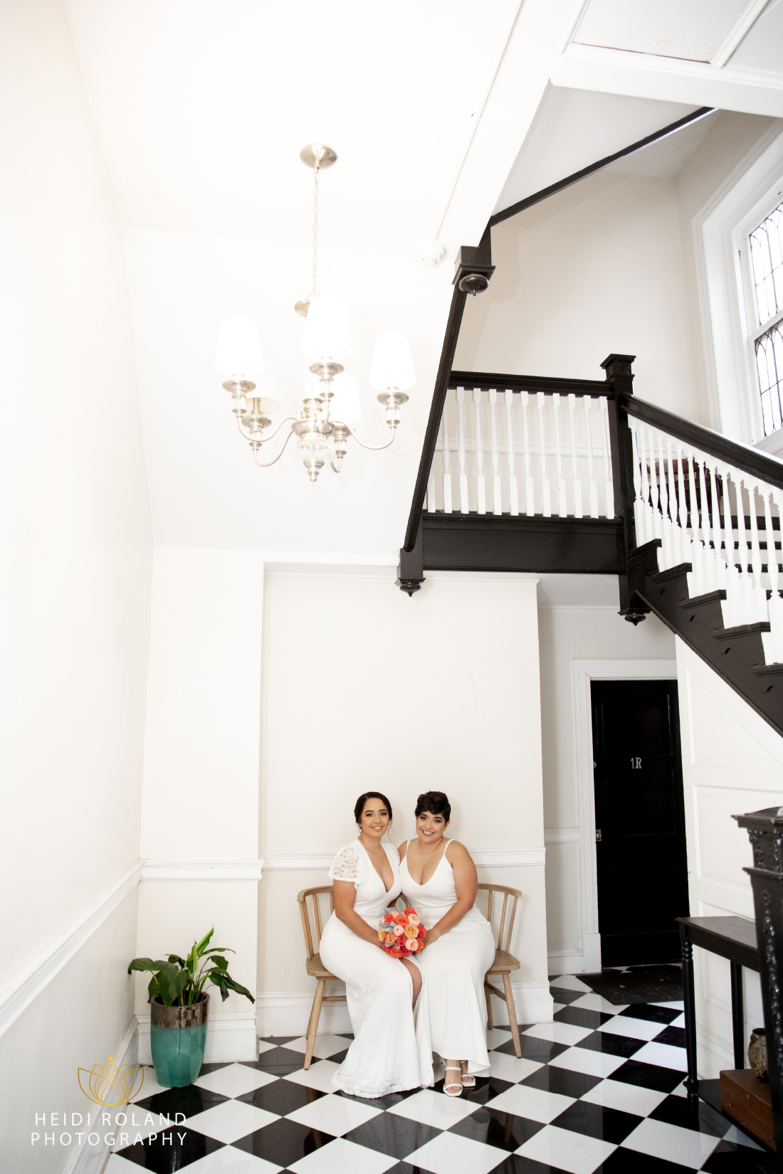 brides near black and white staircase