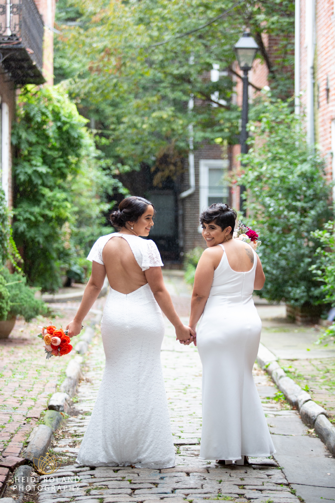 outside wedding photos in Philadelphia, two brides with colorful bouquets