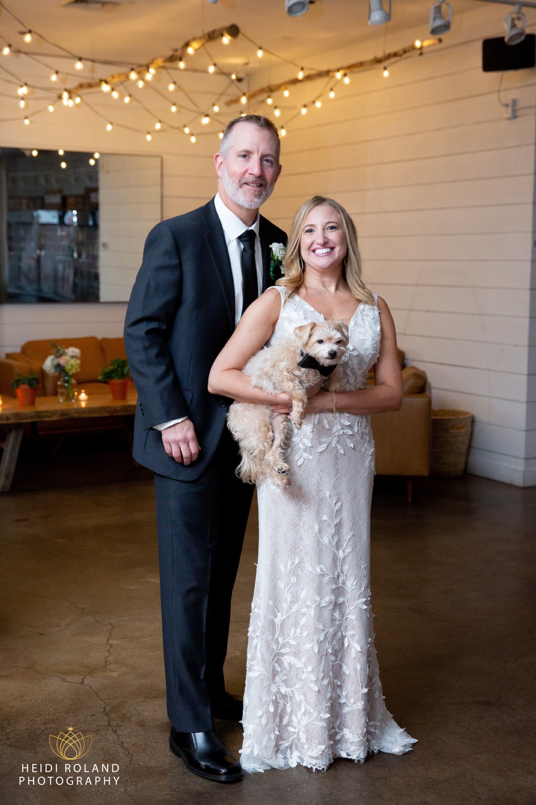 bride and groom with their dog at tela's market wedding