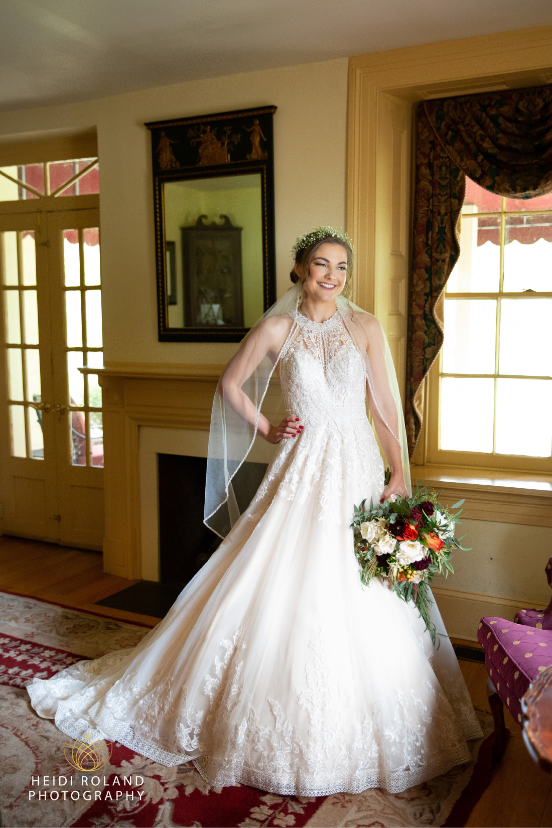 Bride smiling while getting ready at the Joseph Ambler Inn in Pennsylvania