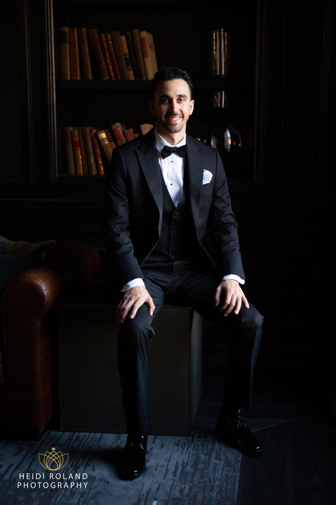 Groom portrait on wedding day in library room by Heidi Roland Photography
