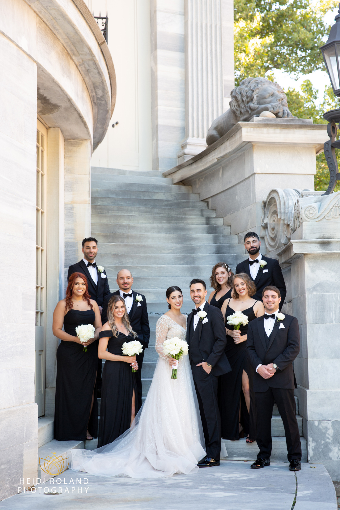 Bride and groom with their bridal party by Heidi Roland Photography