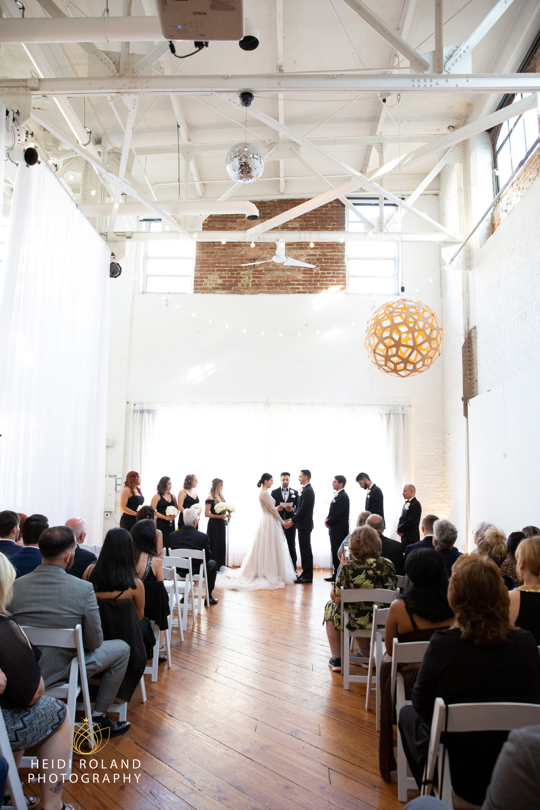 bride and groom at the altar saying vows by Heidi Roland photography