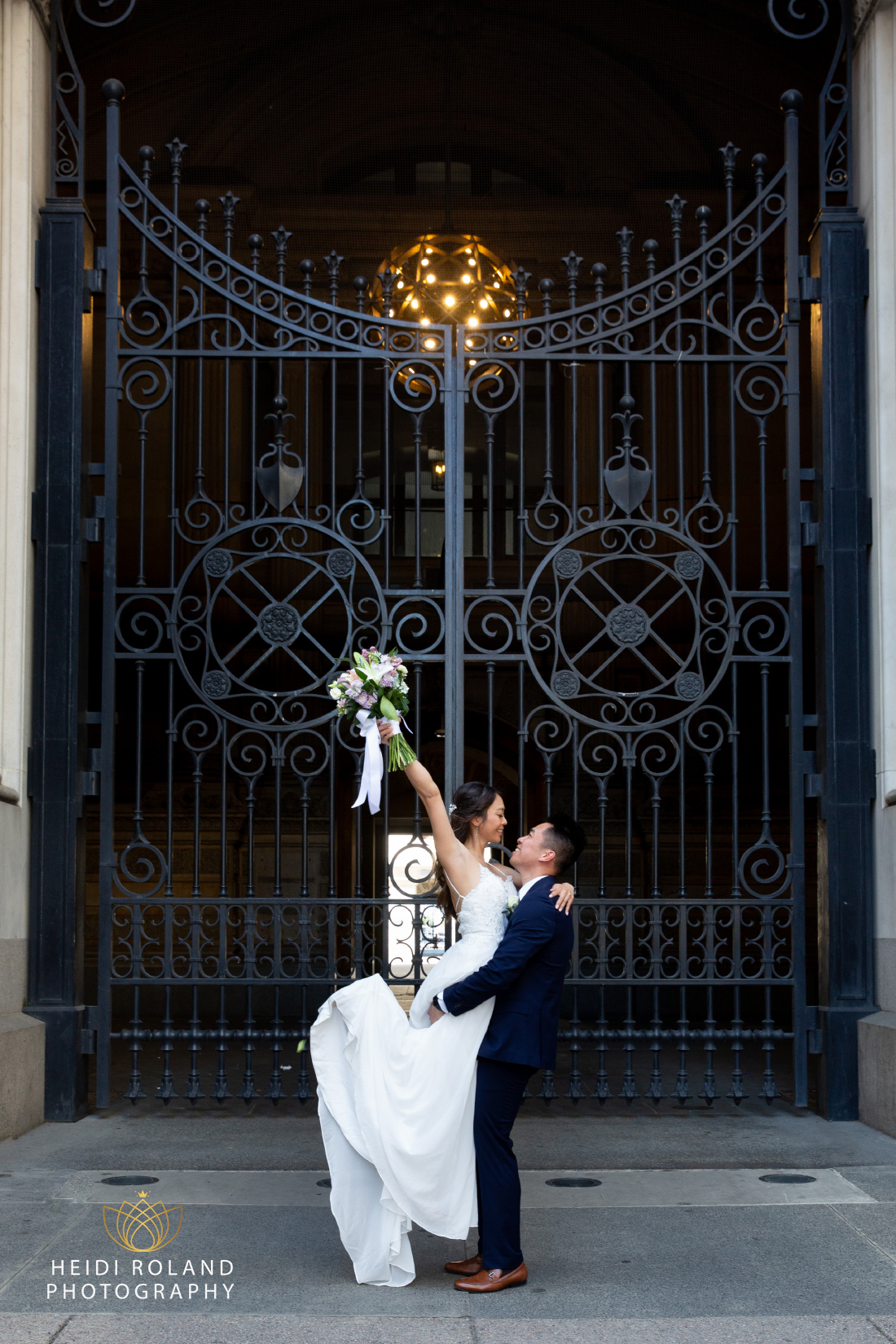 Bride and groom outside Philly City Hall on their wedding day