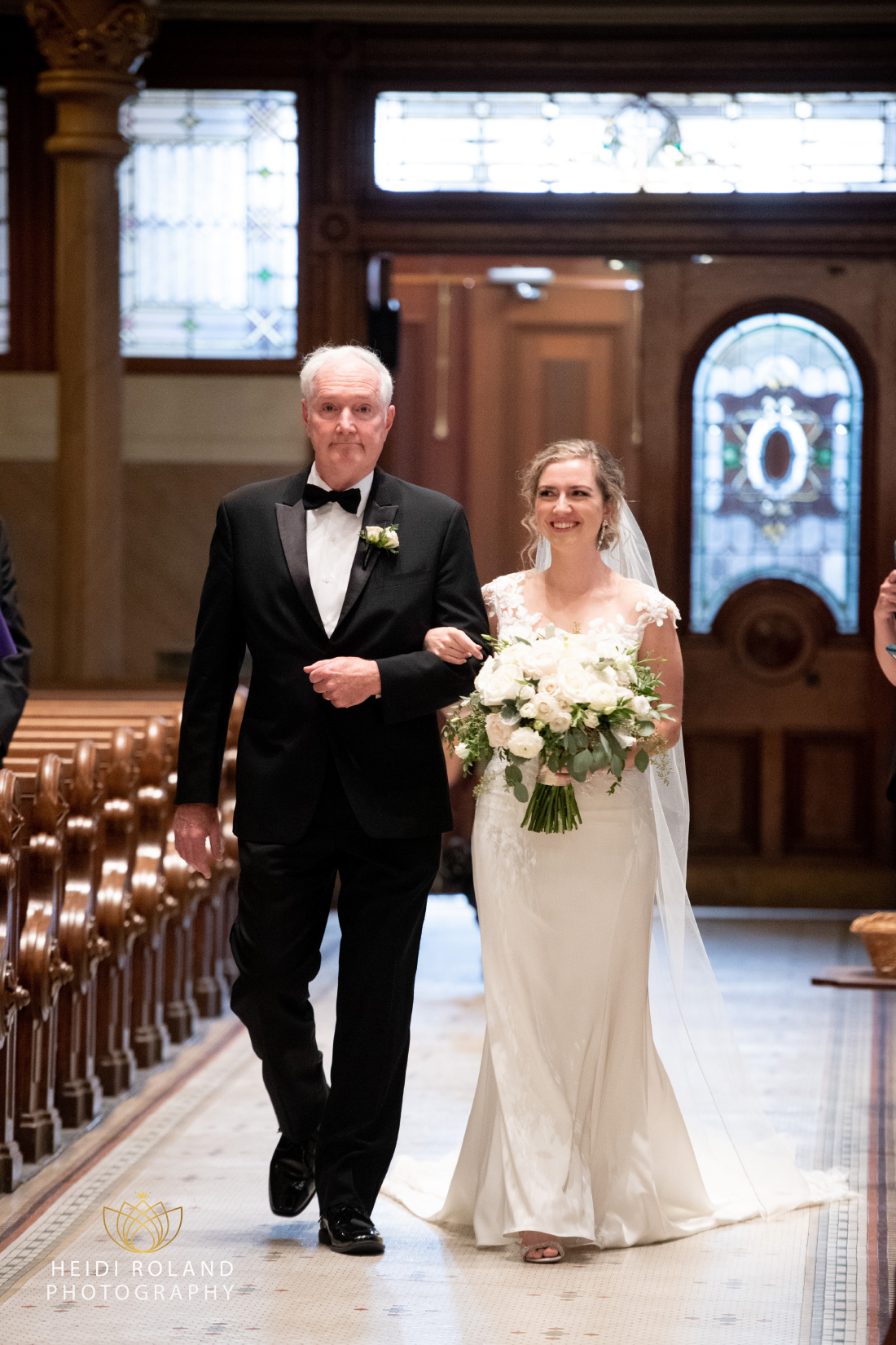 Bride walking down the aisle with her father at philadelphia wedding