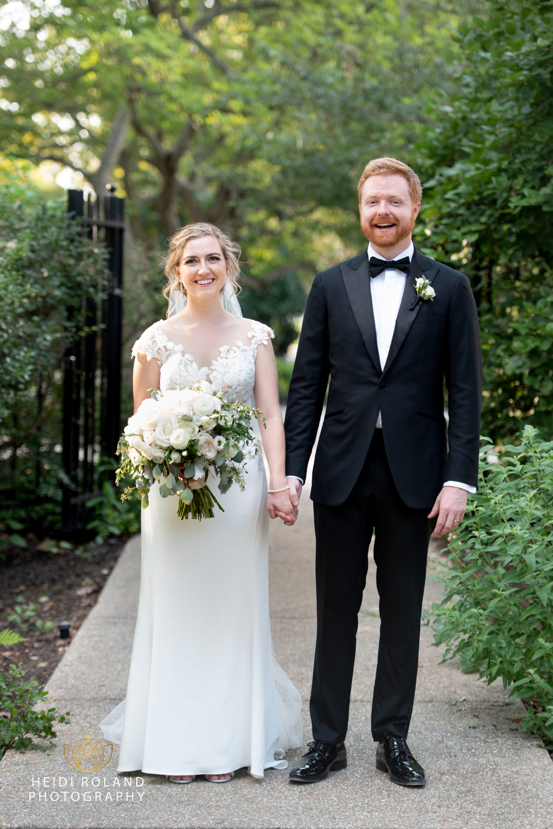 Bride and groom in walkway at Barnes Foundation on wedding day in Philly