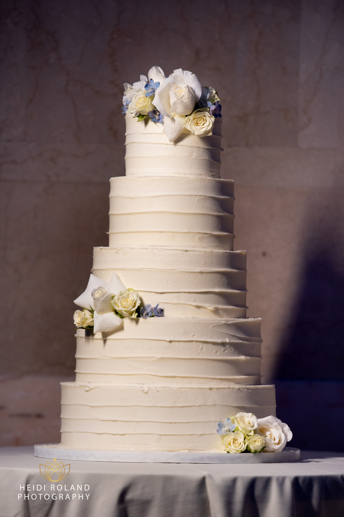 Wedding cake with blue and white flowers at Philadelphia wedding