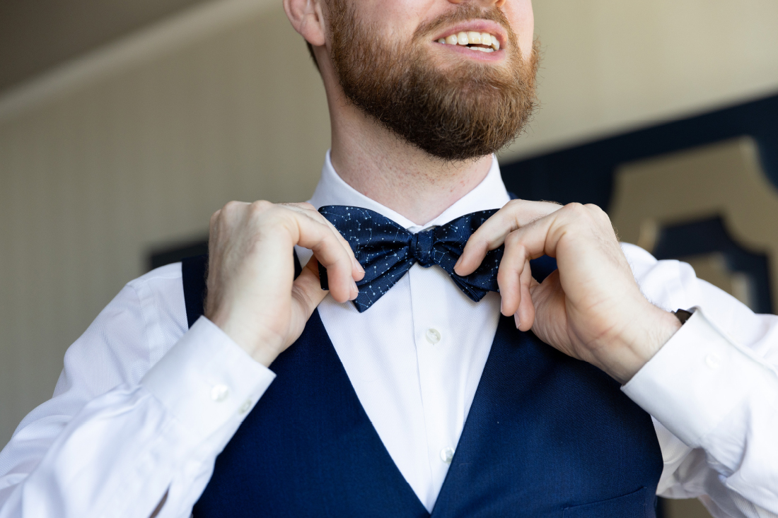 groom with constellation bow tie