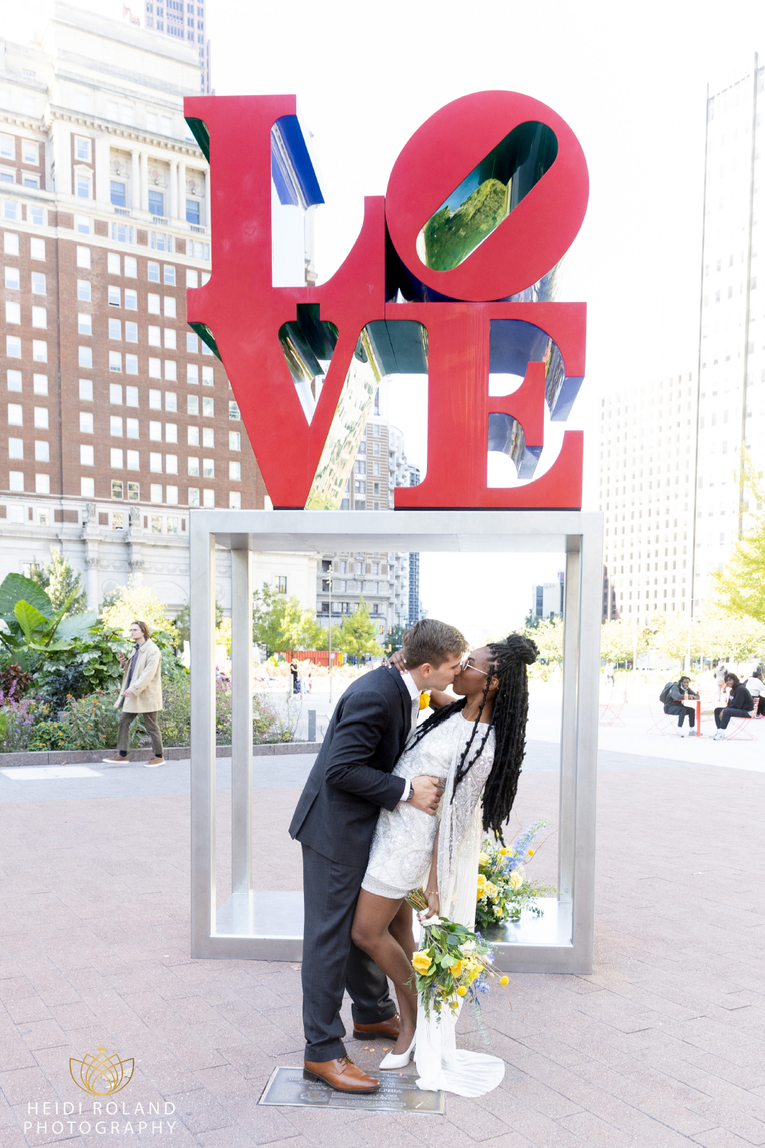 bride and groom weddding photos Love Park Statue in Philadelphia